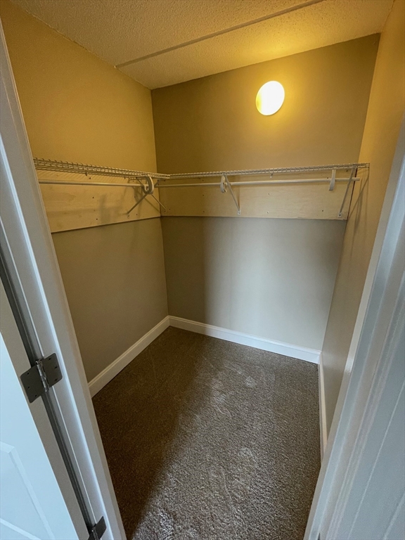 59 Cambridge Road, Unit 108 Woburn, MA 01801 - Photo 10 of 11 a view of a room with wooden floor