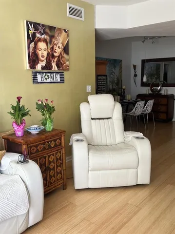 a kitchen with stainless steel appliances granite countertop a refrigerator and a microwave