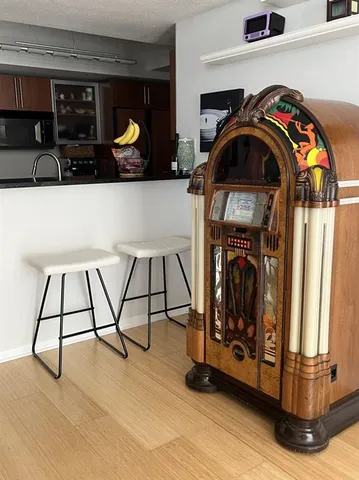 a kitchen with stainless steel appliances granite countertop a sink stove and a refrigerator