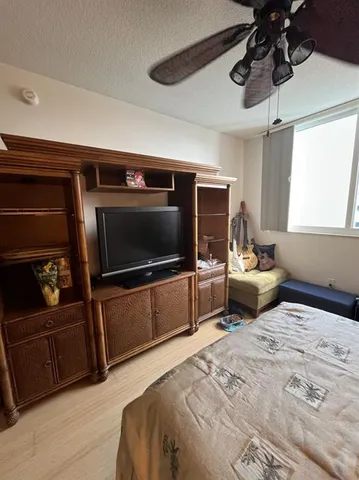 a room with furniture and flat screen tv