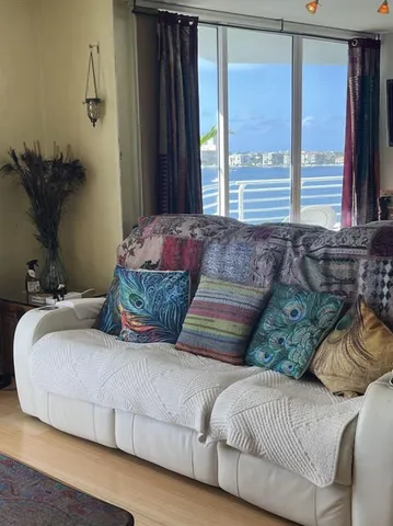 a living room with furniture and flat screen tv