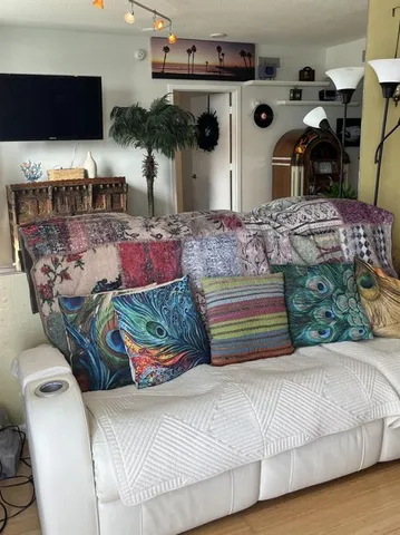 a bed room with a bed and a chair