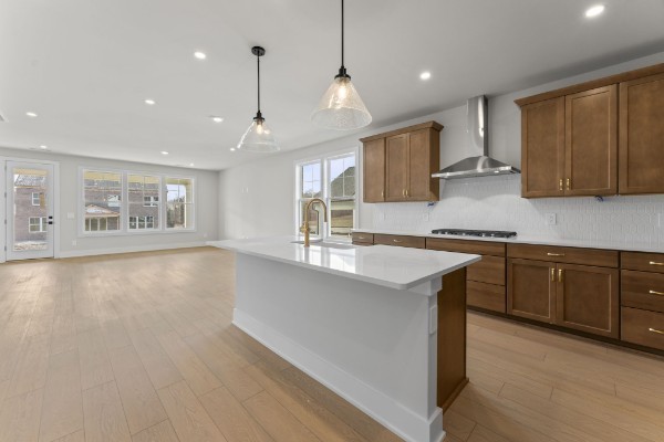 826 Silva Loop Mount Juliet, TN 37122 - Photo 13 of 24 a kitchen with stainless steel appliances granite countertop a sink stove and wooden floor
