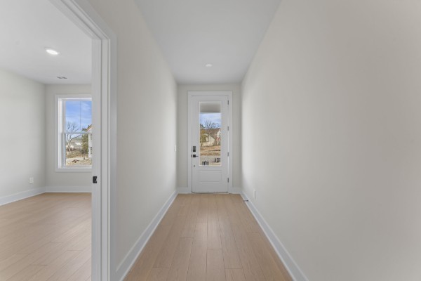 826 Silva Loop Mount Juliet, TN 37122 - Photo 16 of 24 a view of a hallway with wooden floor and a bathroom