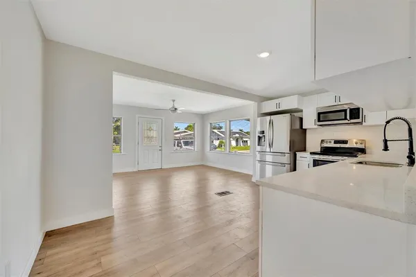 a view of a kitchen with furniture and a stove