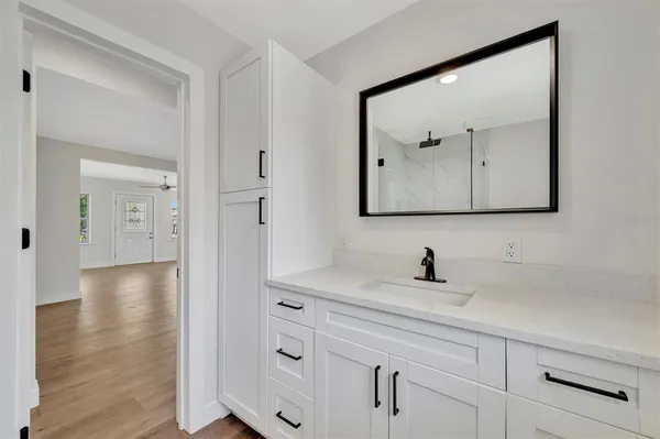 a bathroom with a sink and mirror