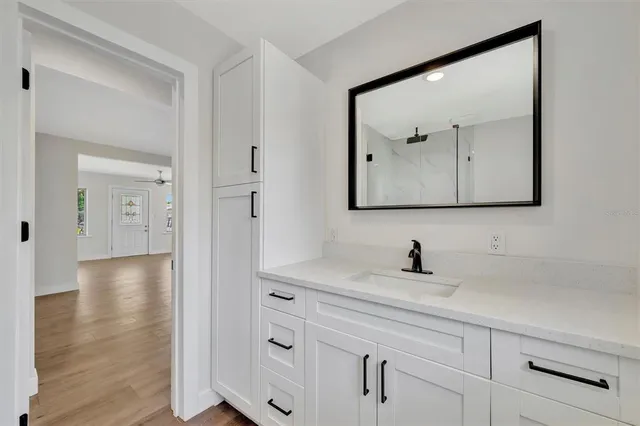 a bathroom with a sink and mirror