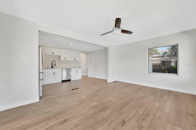 a view of an empty room with a window