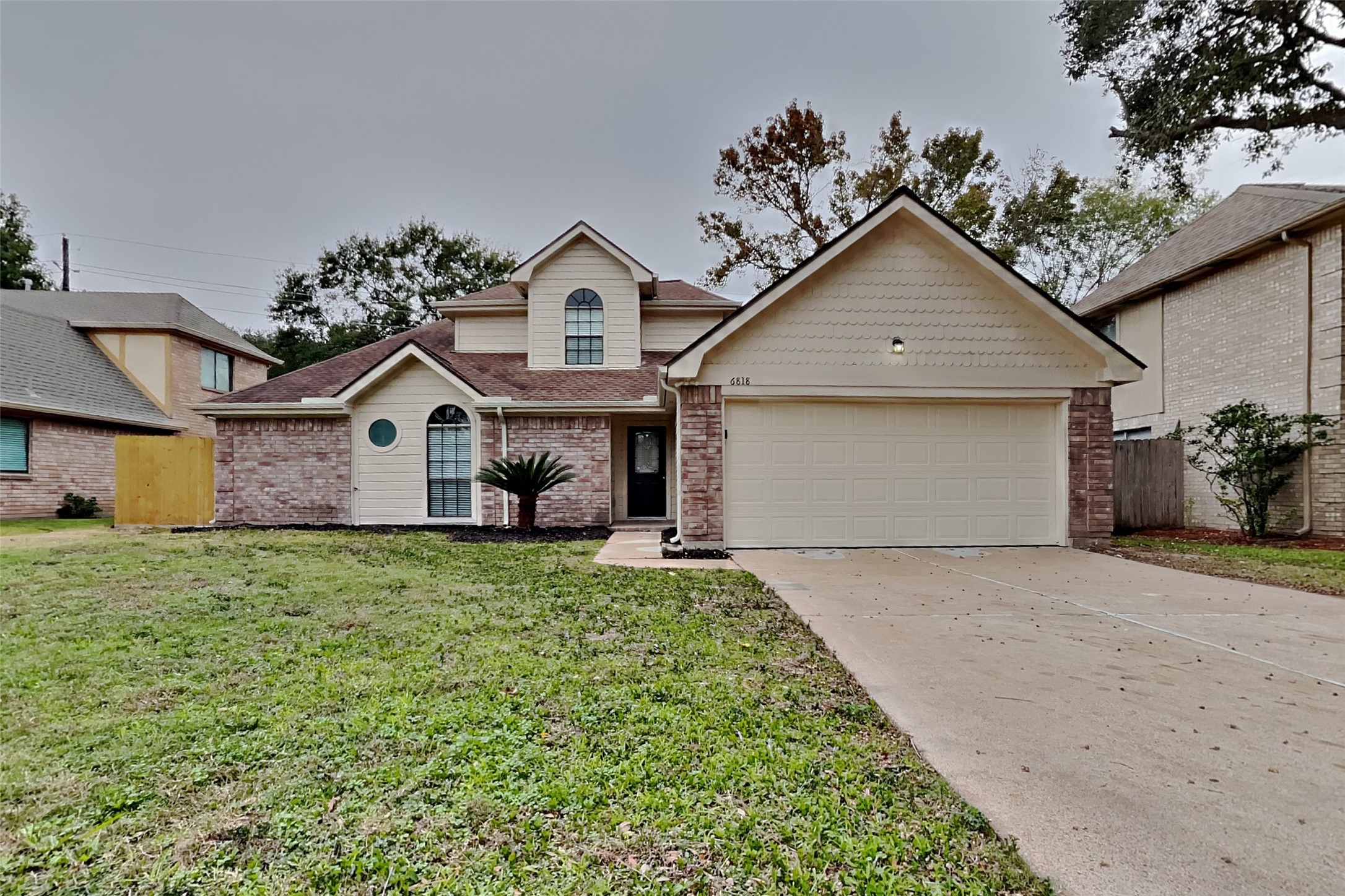 6818 White Tail Drive Spring, TX 77379 - Photo 1 of 24 a view of a house with a yard and garage