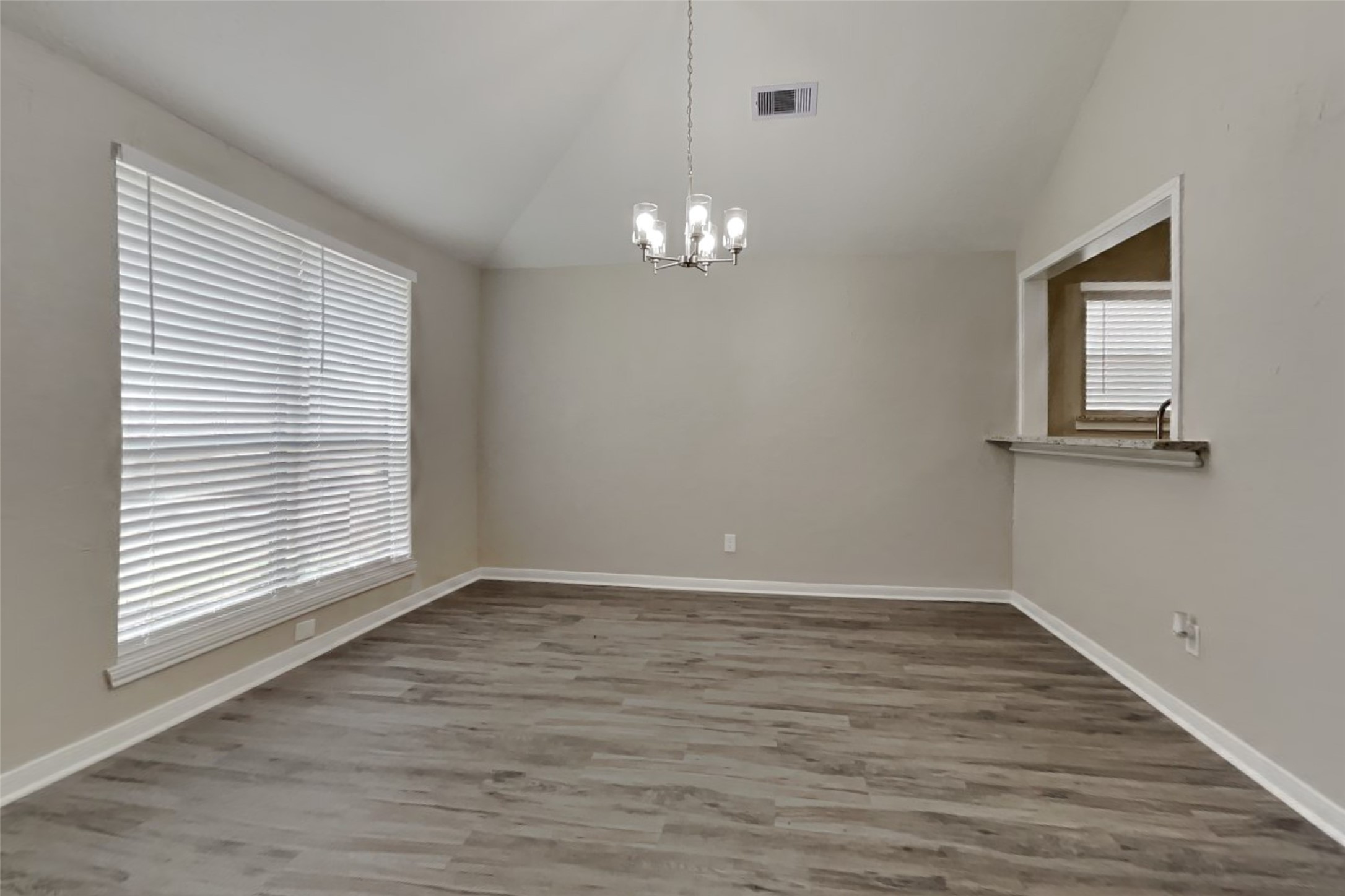 6818 White Tail Drive Spring, TX 77379 - Photo 12 of 24 an empty room with wooden floor and windows