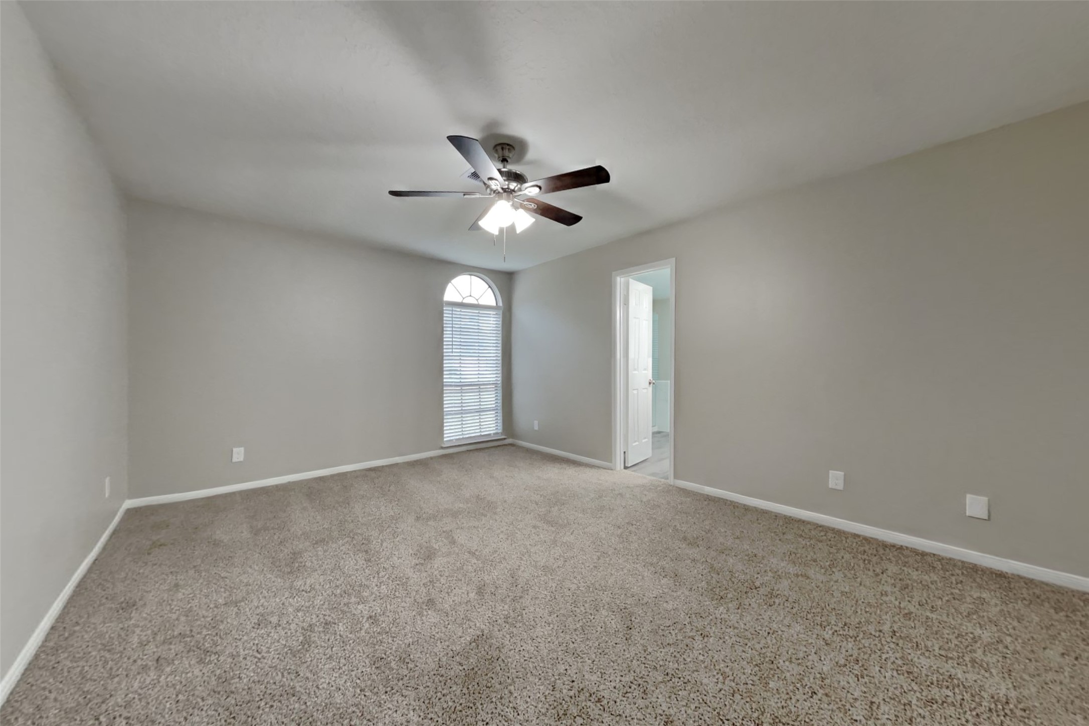 6818 White Tail Drive Spring, TX 77379 - Photo 14 of 24 a view of an empty room with a ceiling fan