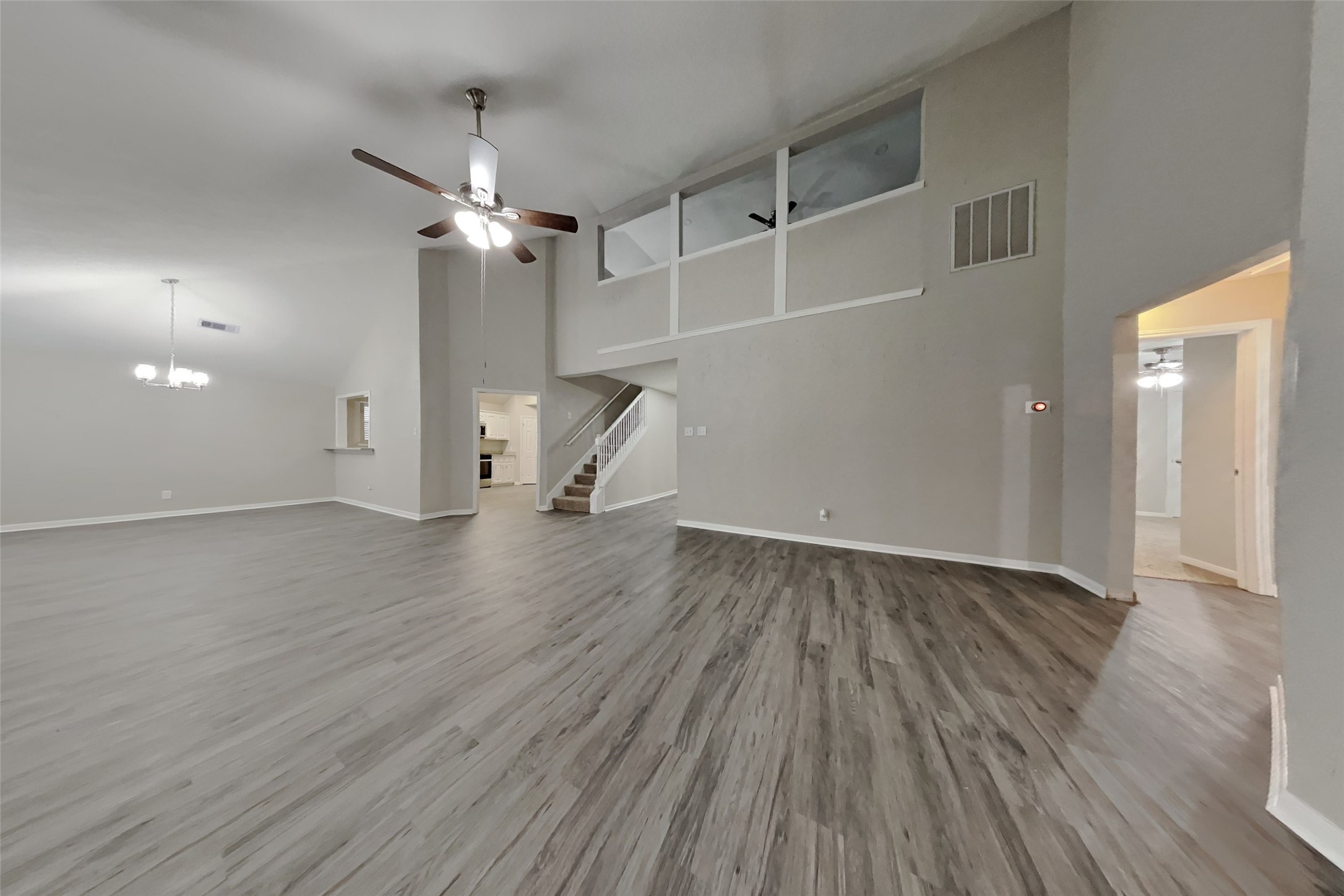 6818 White Tail Drive Spring, TX 77379 - Photo 2 of 24 wooden floor in an empty room with a window