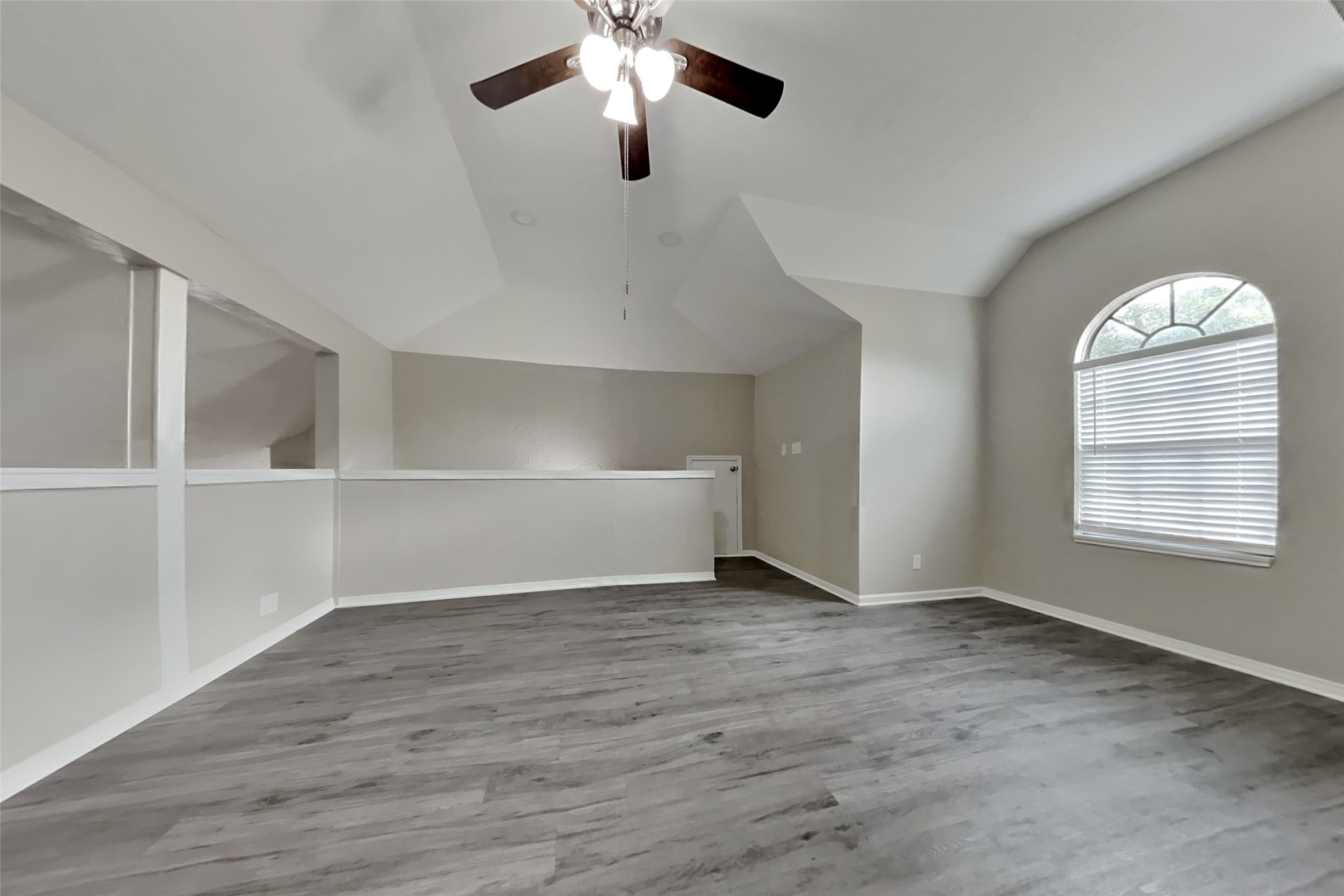 6818 White Tail Drive Spring, TX 77379 - Photo 6 of 24 wooden floor in an empty room with a window