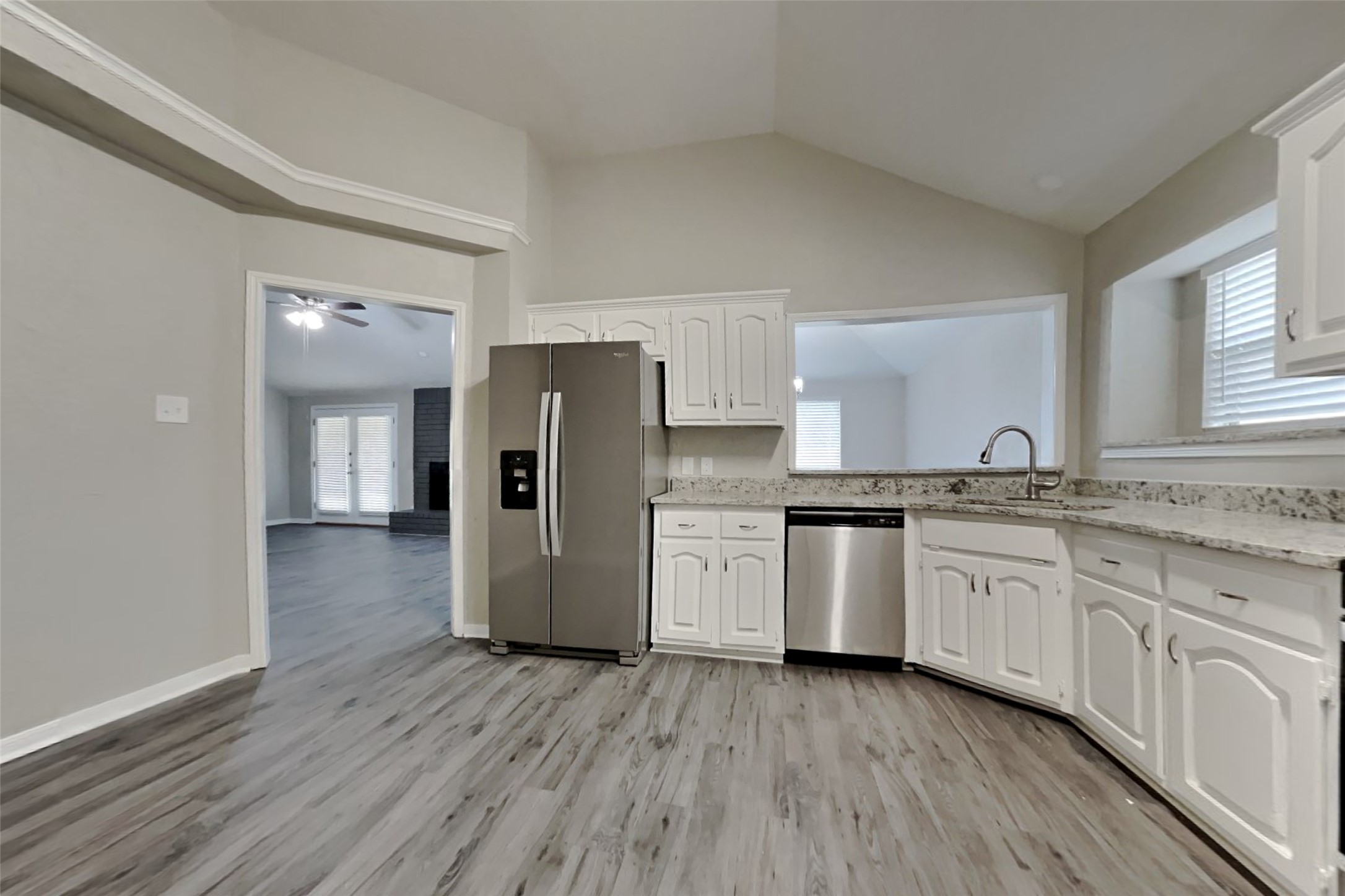 6818 White Tail Drive Spring, TX 77379 - Photo 10 of 24 a kitchen with a refrigerator and a sink