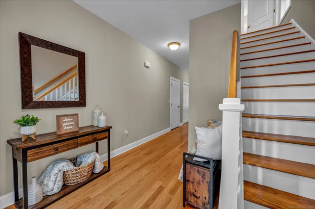 a view of an entryway with wooden floor