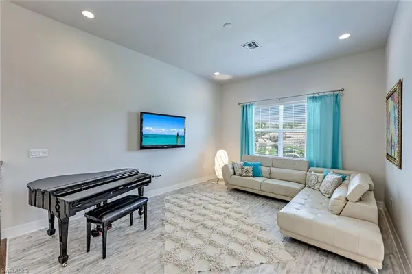 a bathroom with a bathtub shower and a sink