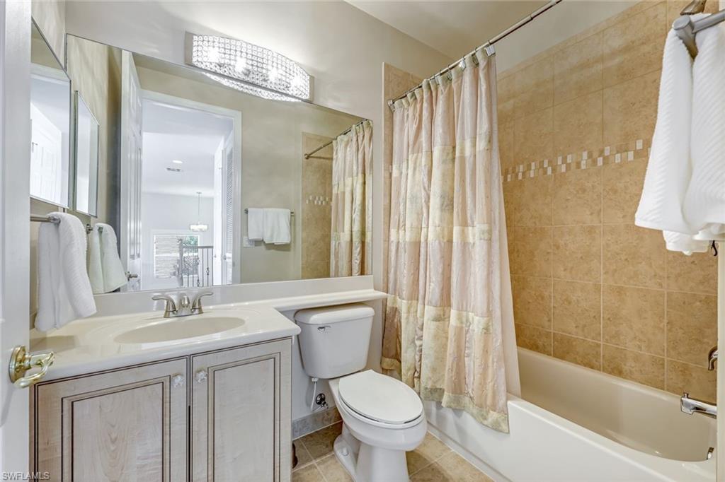 6582 Monterey Point Naples, FL 34105 - Photo 20 of 28 a bathroom with a granite countertop sink toilet and shower