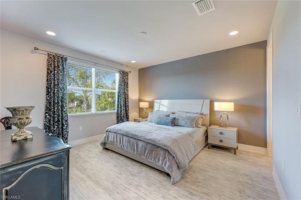 6582 Monterey Point Naples, FL 34105 - Photo 21 of 28 a bedroom with a bed and window