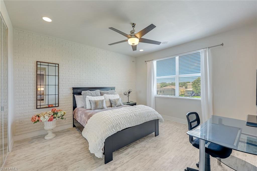 6582 Monterey Point Naples, FL 34105 - Photo 22 of 28 a bedroom with a bed furniture and a window