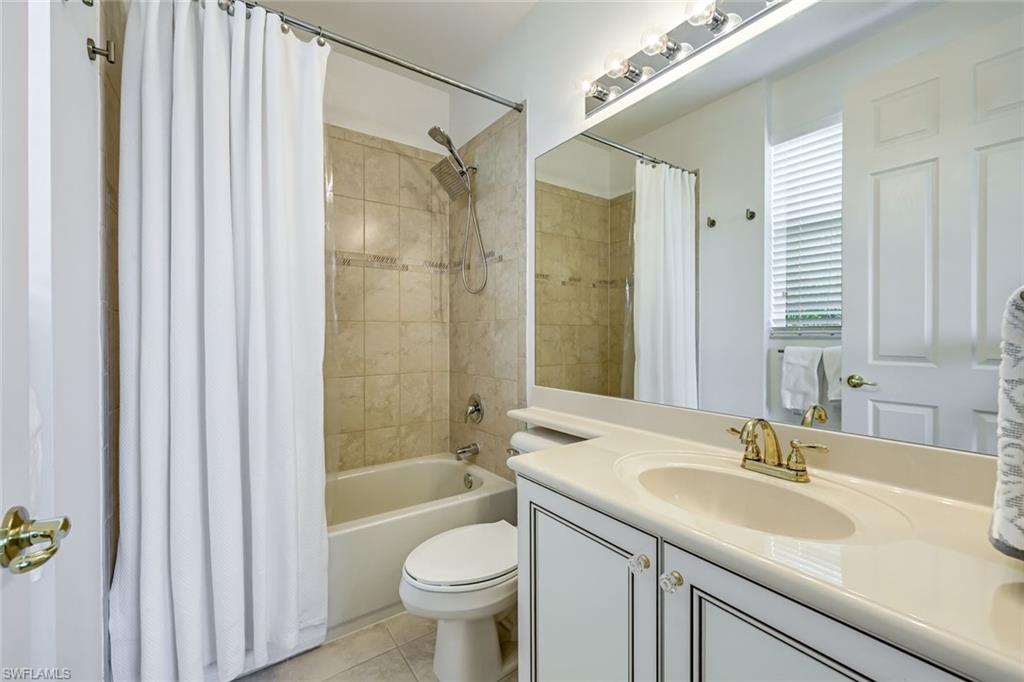 6582 Monterey Point Naples, FL 34105 - Photo 22 of 28 a bathroom with a sink a toilet and shower