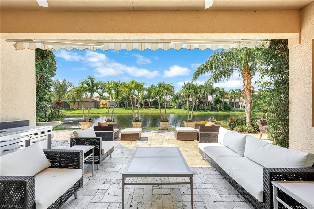 6582 Monterey Point Naples, FL 34105 - Photo 25 of 28 a view of a patio with couches chairs and a table