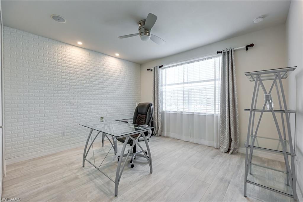 6582 Monterey Point Naples, FL 34105 - Photo 25 of 28 a view of a workspace with furniture and a window