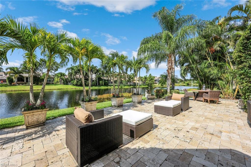 6582 Monterey Point Naples, FL 34105 - Photo 27 of 28 a view of a lake with couches and city view