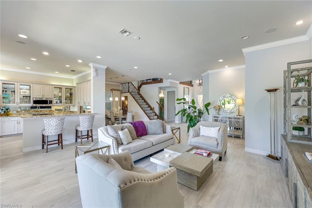 6582 Monterey Point Naples, FL 34105 - Photo 3 of 28 a living room with furniture and wooden floor