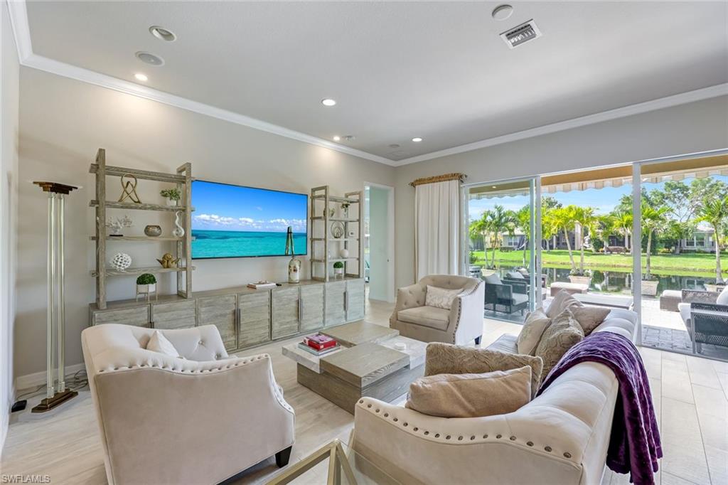 6582 Monterey Point Naples, FL 34105 - Photo 5 of 28 a living room with furniture and a large window
