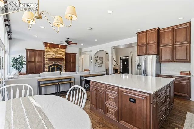 a kitchen with sink stove and cabinets