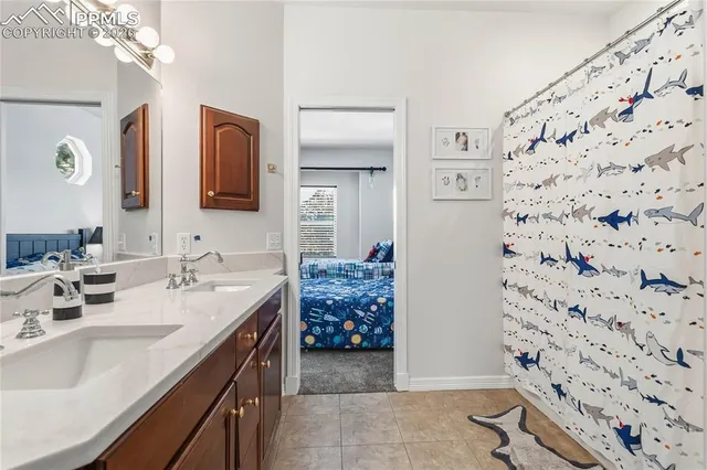 a bathroom with a sink mirror and vanity