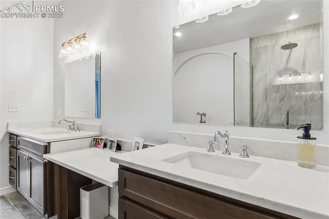 a bathroom with a sink vanity mirror and toilet