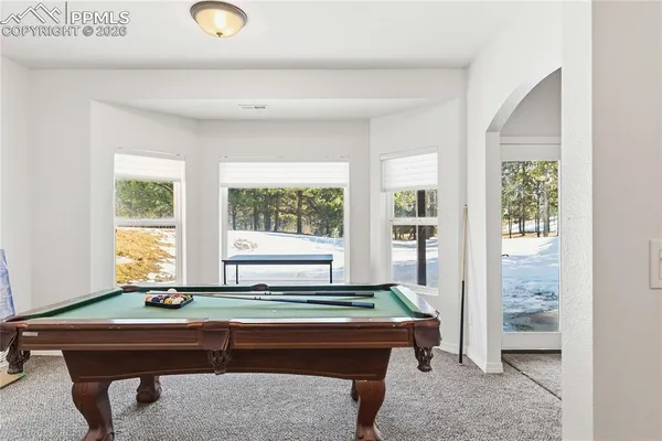 a kitchen with stainless steel appliances a refrigerator and a stove top oven