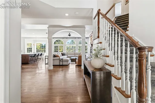 a view of entryway livingroom and hall with wooden floor