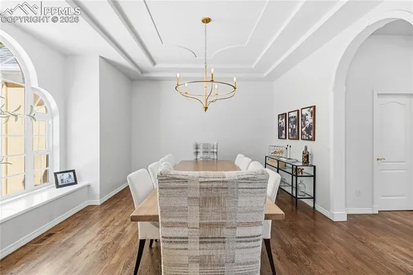 a view of a dining room with furniture window and wooden floor
