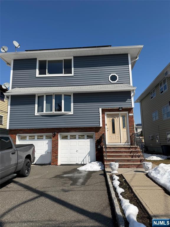 79 Hunter Street Lodi, NJ 07644 - Photo 2 of 11 a front view of a house with a yard