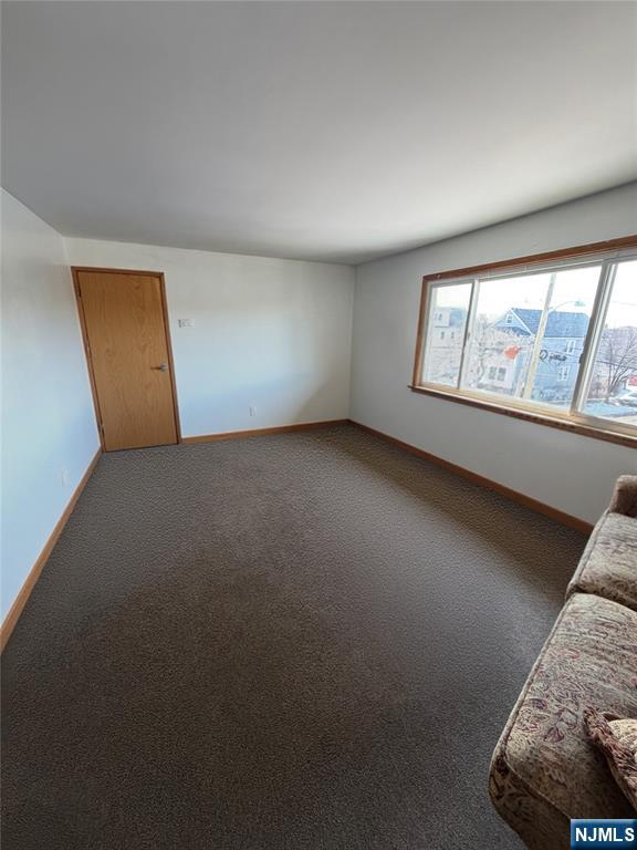 79 Hunter Street Lodi, NJ 07644 - Photo 3 of 11 an empty room with windows