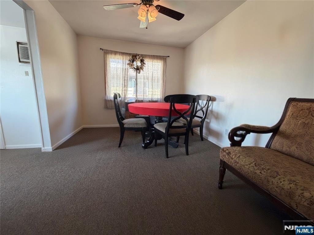 79 Hunter Street Lodi, NJ 07644 - Photo 4 of 11 a living room with furniture and a window