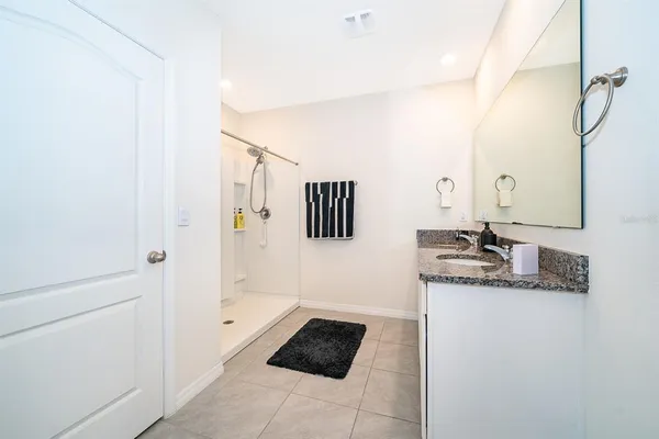 a bathroom with a bathtub and a sink