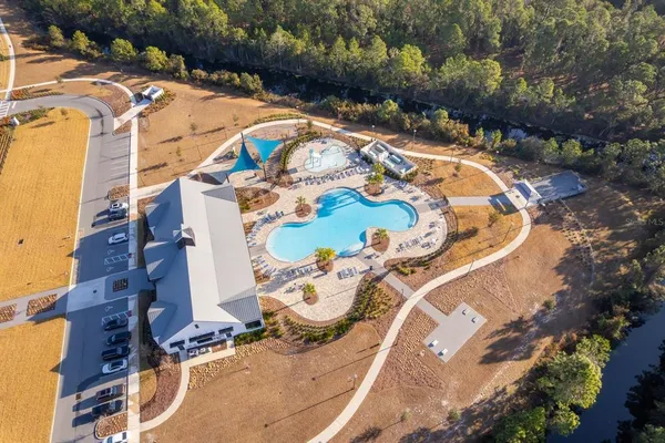 a view of swimming pool with a yard