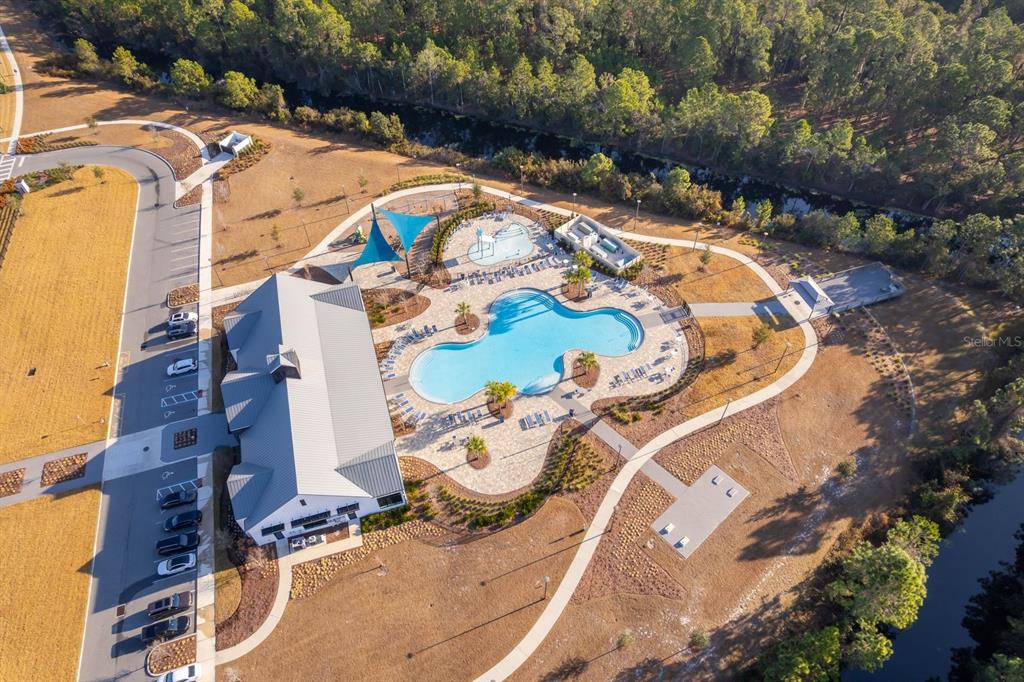 2795 Harmonia Hammock Road St. Cloud, FL 34773 - Photo 26 of 30 an aerial view of a house with a yard and greenery