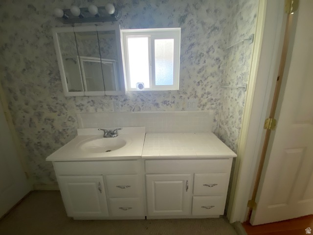 913 East 5300 North Helper, UT 84526 - Photo 23 of 29 Bathroom featuring wallpapered walls and vanity
