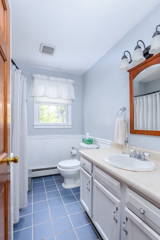 32 Westview Road Worcester, MA 01602 - Photo 7 of 18 a bathroom with a granite countertop toilet sink and mirror