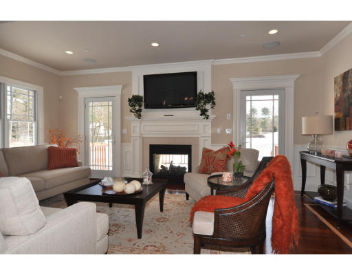 1 Ann's Way Dover, MA 02030 - Photo 12 of 26 a living room with furniture a flat screen tv and a fireplace