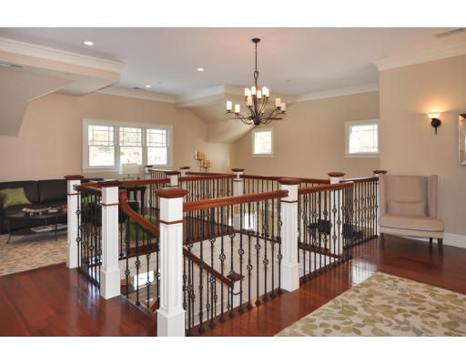 1 Ann's Way Dover, MA 02030 - Photo 18 of 26 a view of staircase and living room with wooden floor