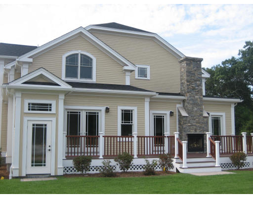 1 Ann's Way Dover, MA 02030 - Photo 5 of 26 a front view of a house with a yard