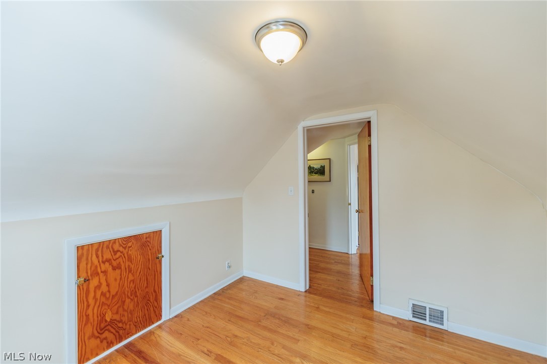 3206 Hearthstone Road Parma, OH 44134 - Photo 27 of 33 Additional living space with light wood-type flooring and vaulted ceiling