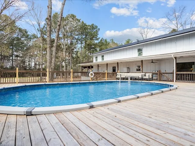 a view of swimming pool with outdoor seating