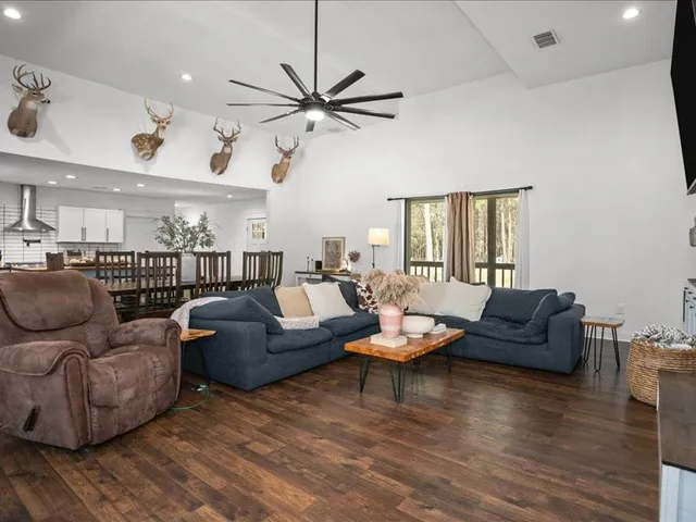 a living room with furniture and a large window