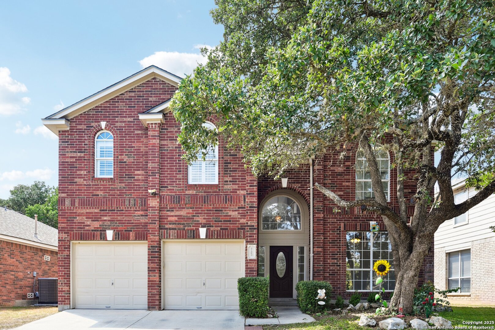 a front view of a building with tree s